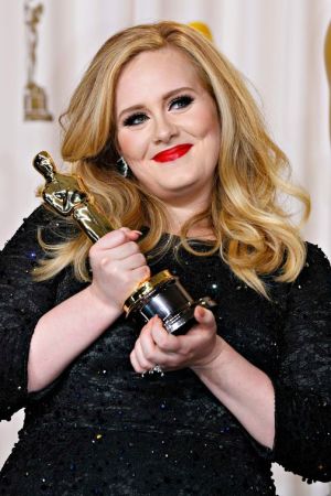 Singer and songwriter Adele accepting Academy Award